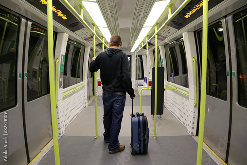 Man with Suitcase on an empty train.