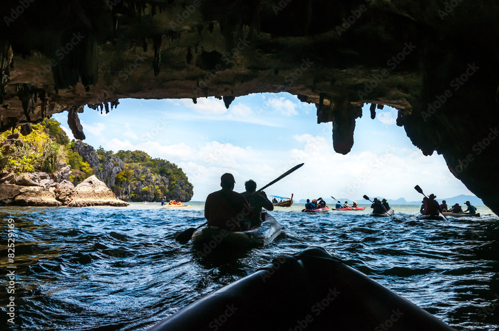 Naklejka premium Canoeing through the cave into the lagoon at Phang nga bay, Thai