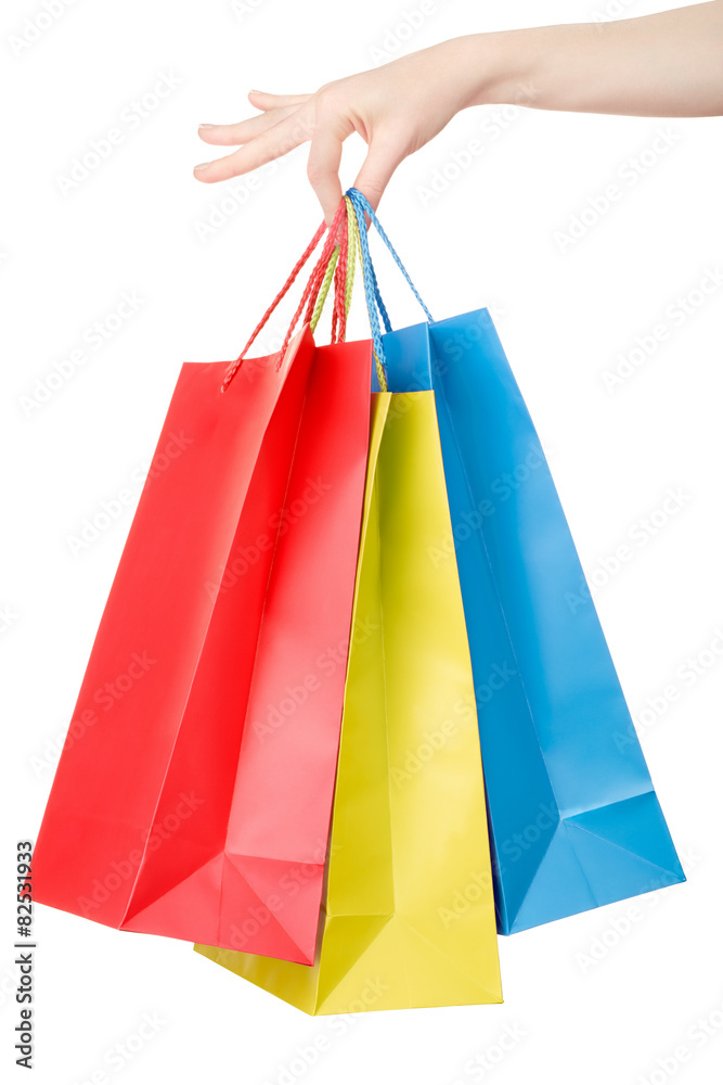 Woman hand holding shopping bags on white, clipping path