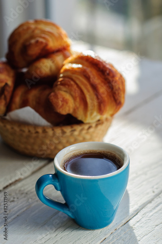 Fototapeta Naklejka Na Ścianę i Meble -  Breakfast with fresh baked croissants, butter and coffee