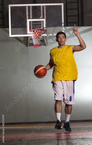 Basketball player carry ball to game competition