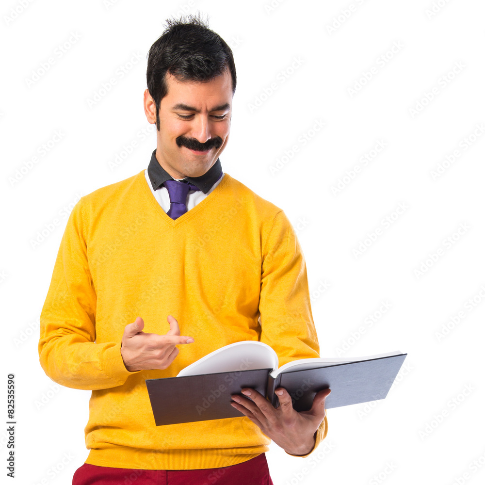 Man with moustache reading book Man with moustache reading book