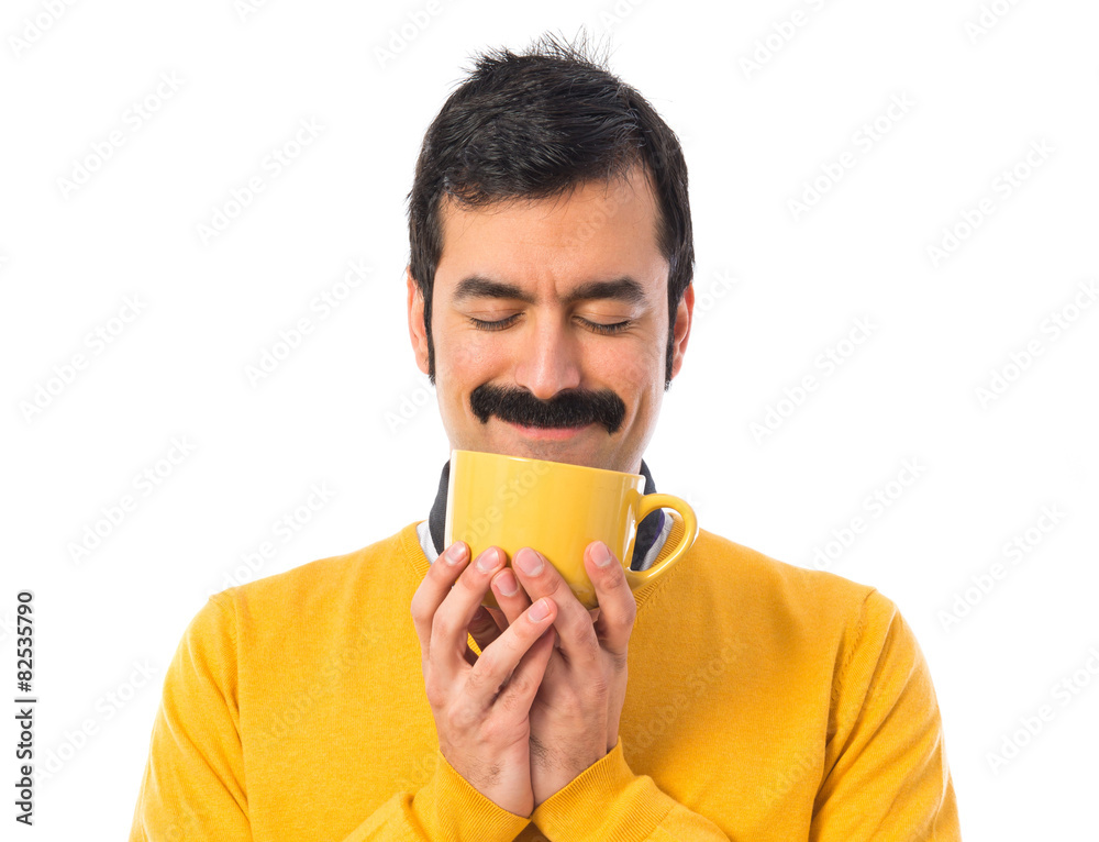 Man with moustache holding a cup of coffee Man with moustache holding a cup of coffee