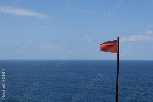 Ocean panorama view with red flag warning © hanohiki