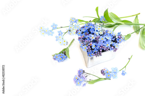 silver heart shape with forget-me-not flowers isolated on white