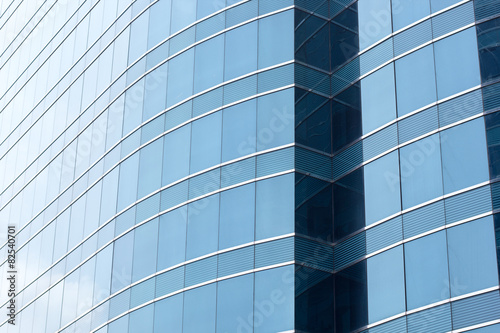 Blue office glass windows background, Asia.