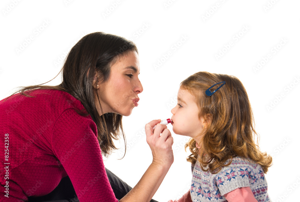 Mother and daughter playing with makeup Mother and daughter playing with makeup