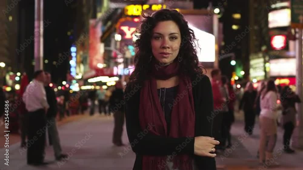 SLO MO MS DS Portrait of woman in Times Square at night, New York City, USA