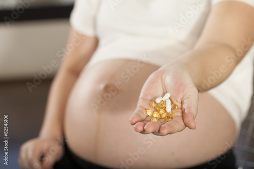 pregnancy care, Asian pregnant woman shows medicines