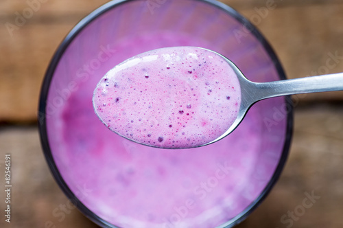 Spoon with berry smoothies