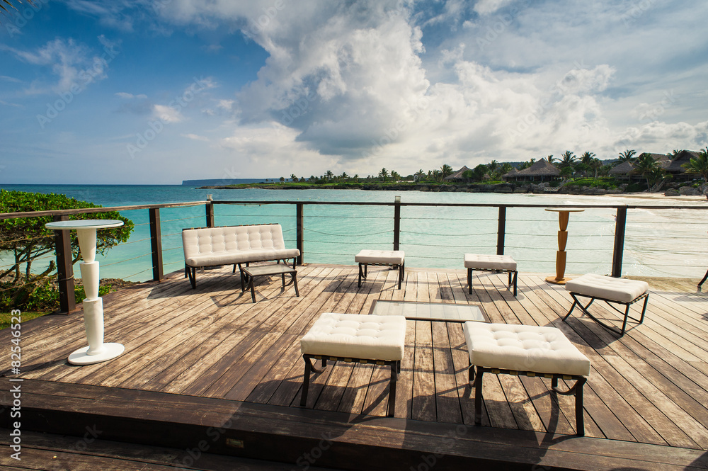 Outdoor restaurant at the beach. Cafe on the beach, ocean and Outdoor restaurant at the beach. Cafe on the beach, ocean and