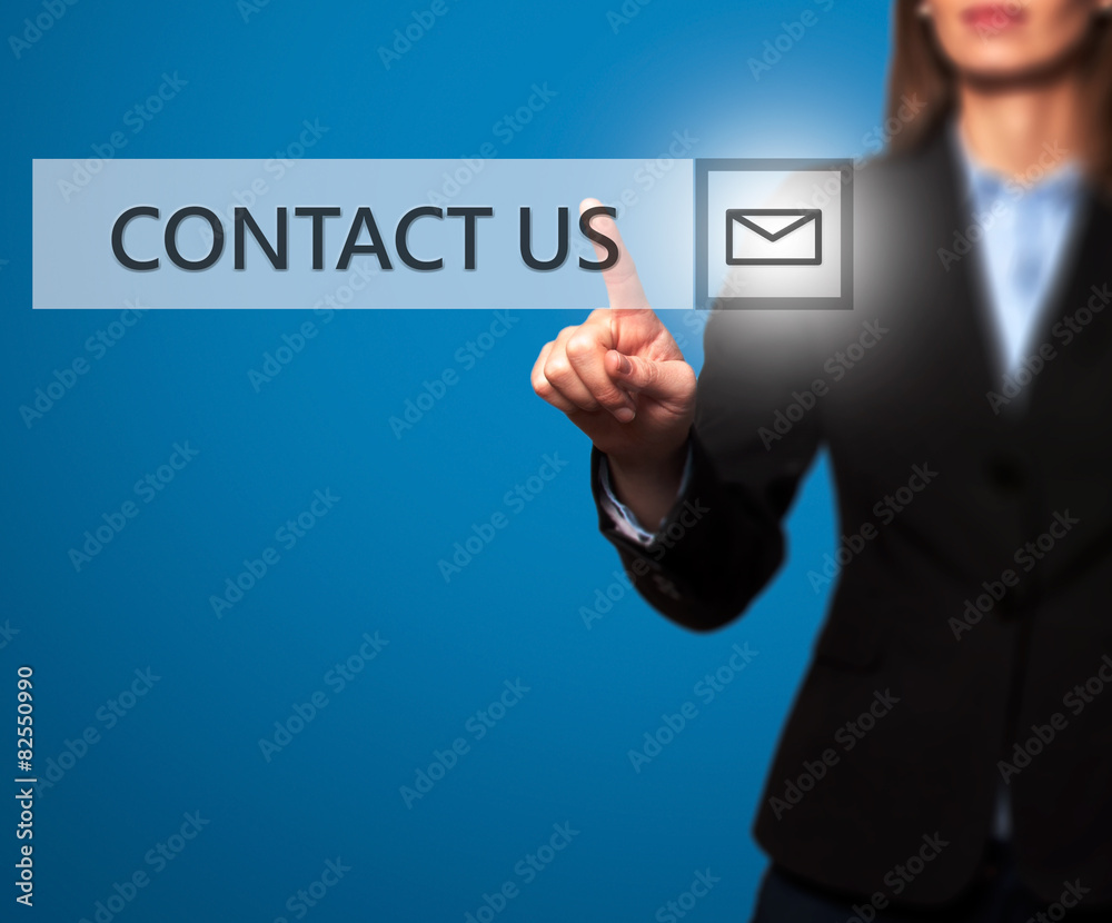 Businesswoman hand pressing contact us button Businesswoman hand pressing contact us button