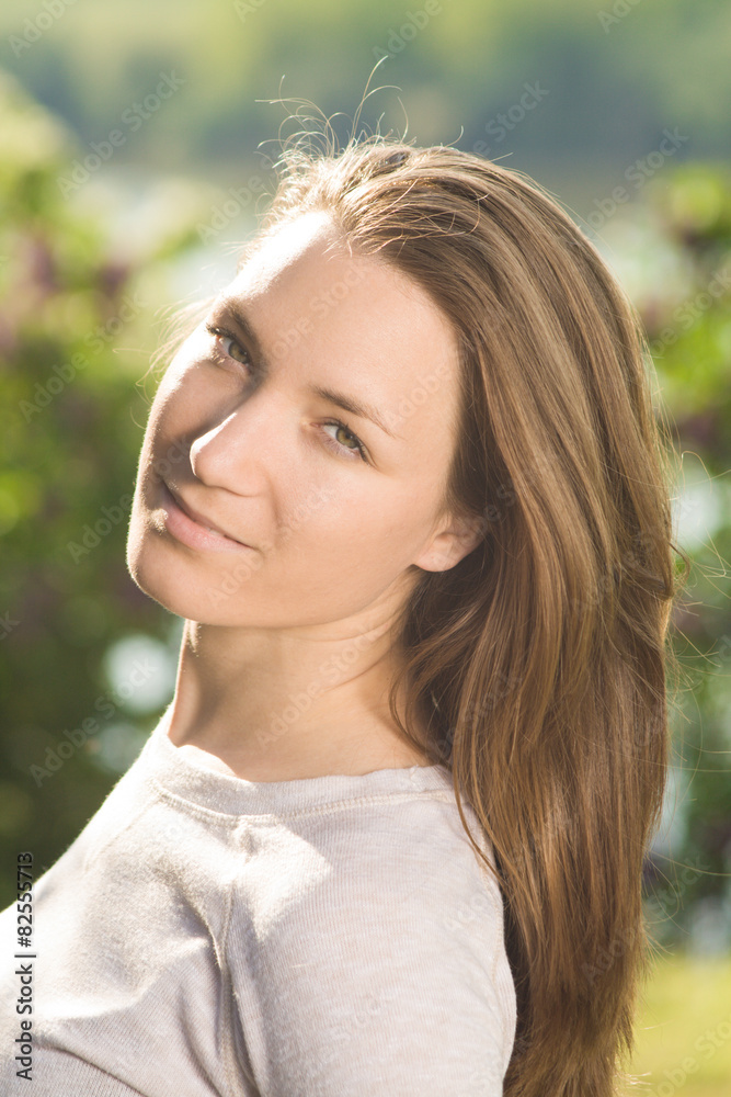Young woman portrait with beautiful hair outdoor smiling Young woman portrait with beautiful hair outdoor smiling
