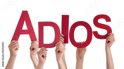 People Holding Spanish Word Adios Means Goodbye photo