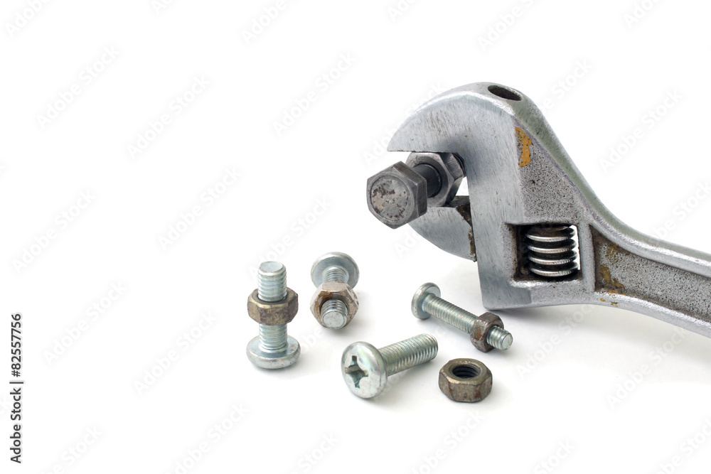 Screwdriver wrench bolts and screws on a white background Screwdriver wrench bolts and screws on a white background