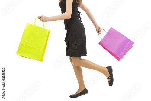 Woman walking with shopping bags in her hands