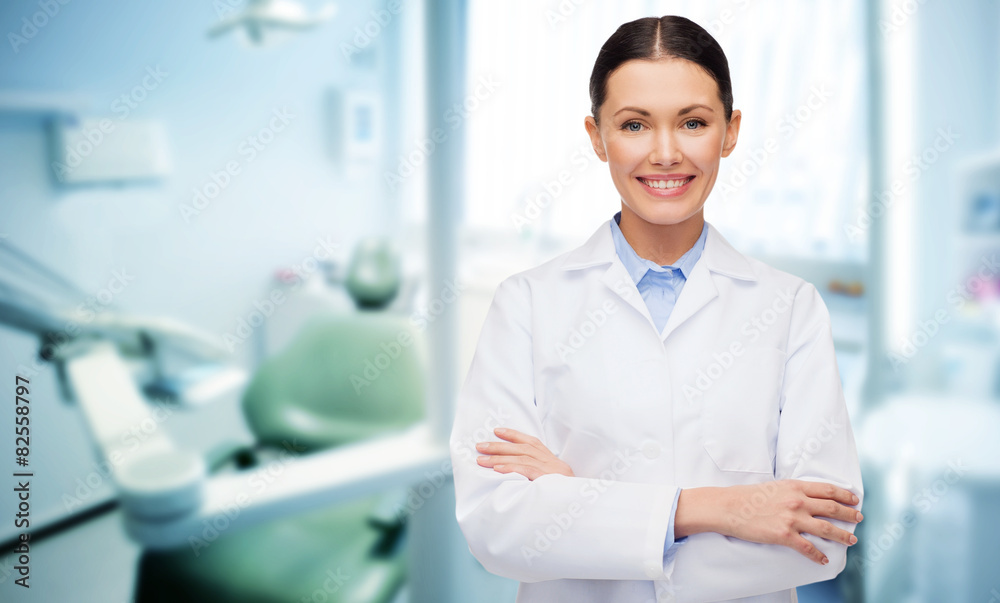 happy young female dentist with tools happy young female dentist with tools