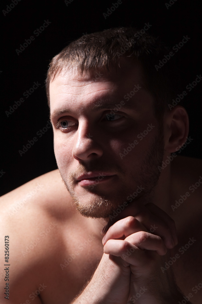 Obraz premium Image of shirtless man keeping his hands by face