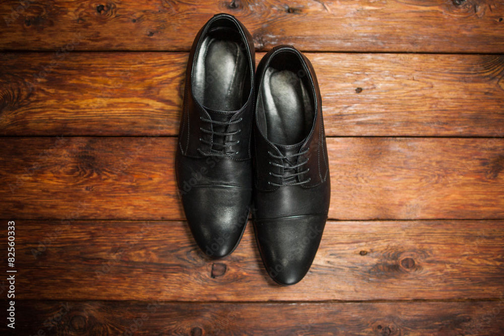 leather men's shoes on a wooden background leather men's shoes on a wooden background
