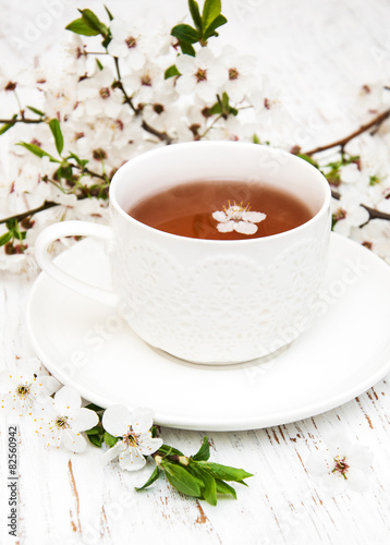 Cup of tea and spring blossom