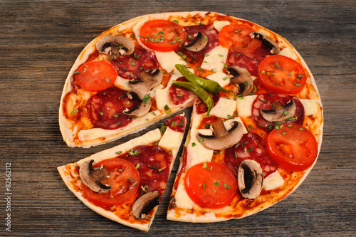 Pizza on a wooden table.