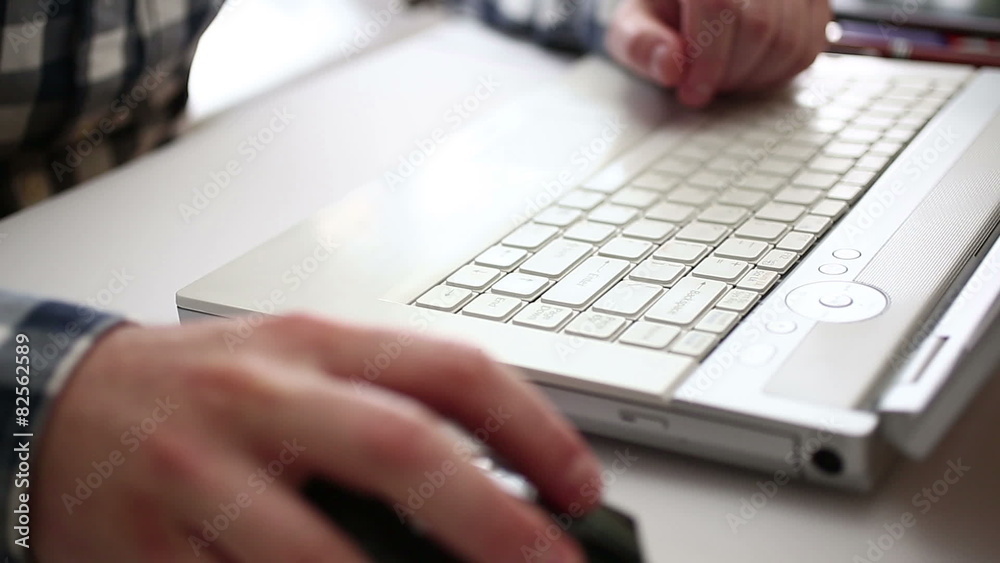 Executive typing on laptop HD in office environment Executive typing on laptop HD in office environment