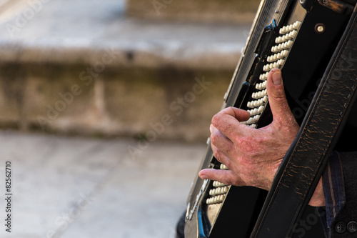 Street musician playing an accordion