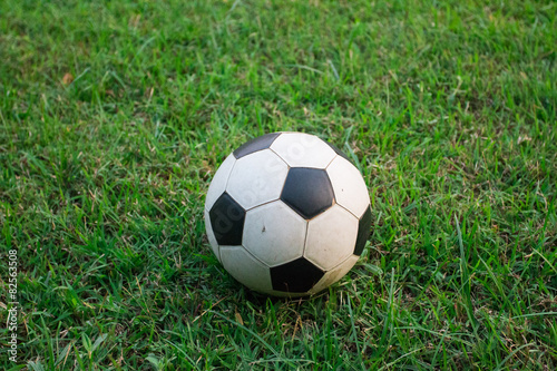 old football on grass © warapatr_s