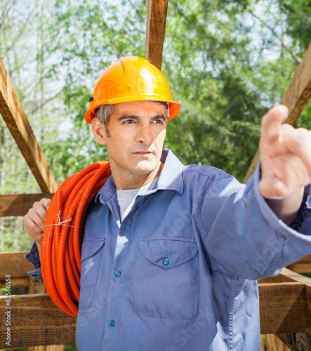 Construction Worker Pointing At Site