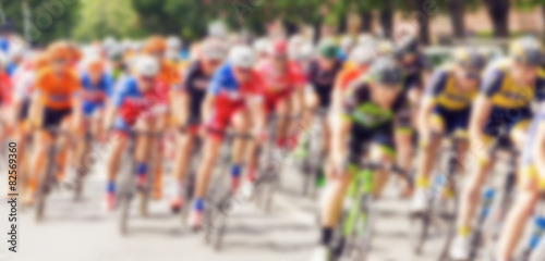 Canvas Print Bikers during bike race on city street, defocussing effect