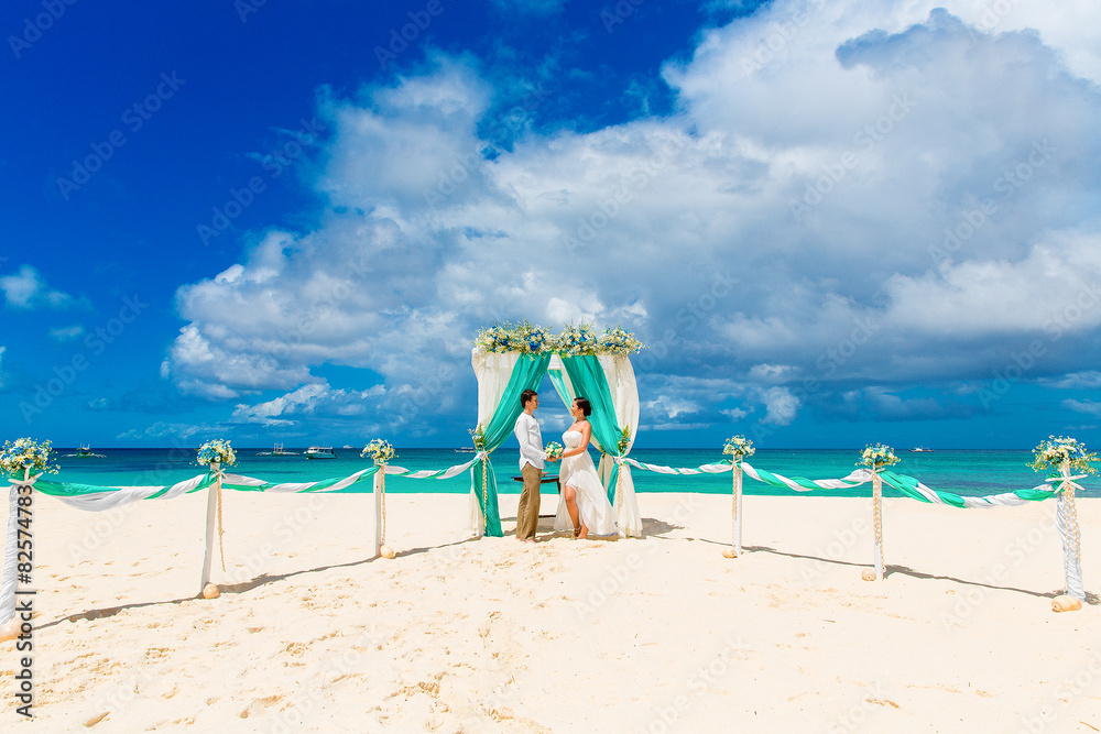 Wedding ceremony on a tropical beach in blue. Wedding ceremony on a tropical beach in blue.