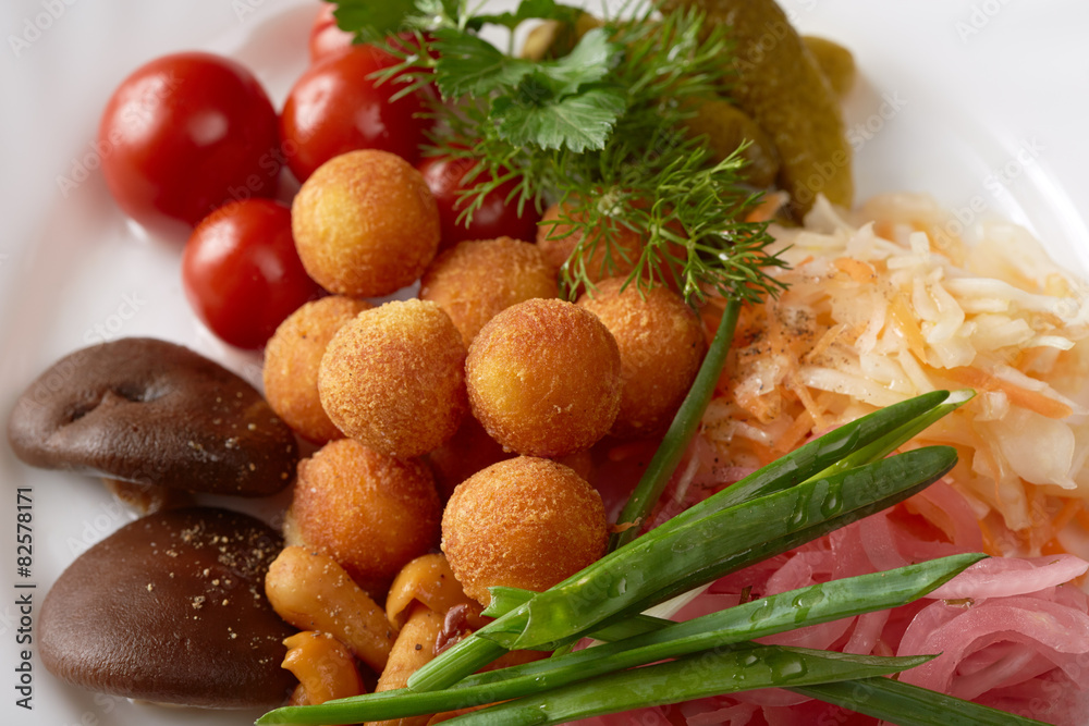 Close-up of cheese balls and pickled vegetables Close-up of cheese balls and pickled vegetables