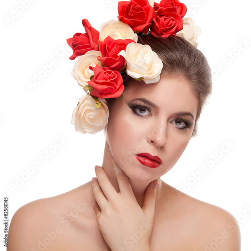Beautiful girl with red lips and flowers in head