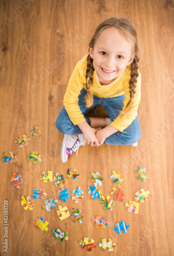 Girl with puzzle photo