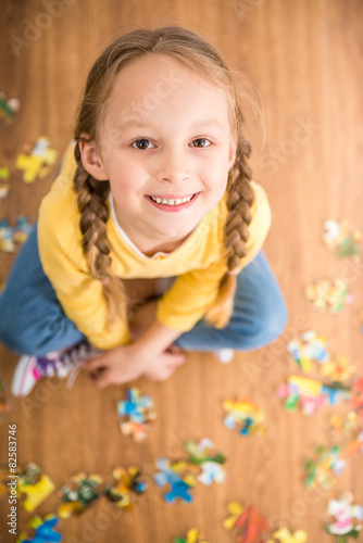 Girl with puzzle photo