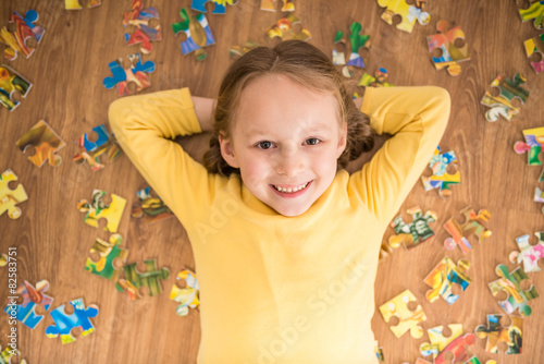 Girl with puzzle photo