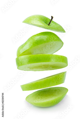 Wallpaper Mural floating sliced green apple isolated on a white background. Torontodigital.ca