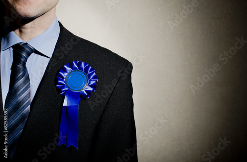 Election candidate with blue rosette. photo