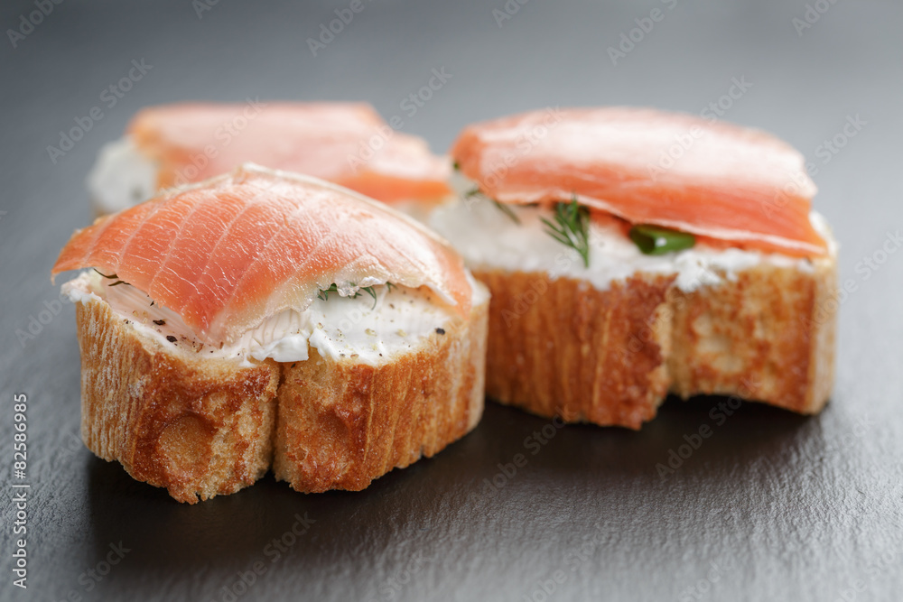 small sandwiches with soft cheese and salmon small sandwiches with soft cheese and salmon
