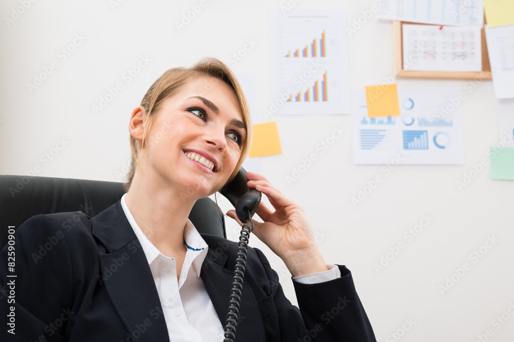 Happy Businesswoman Using Telephone Happy Businesswoman Using Telephone