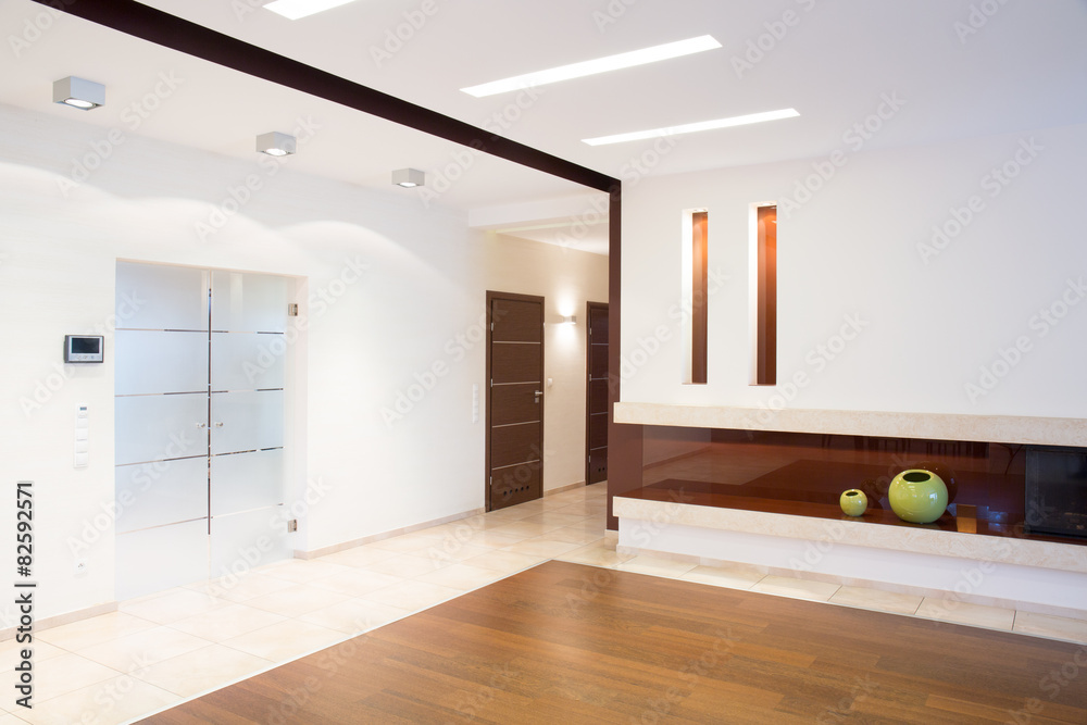 Bright corridor with fireplace