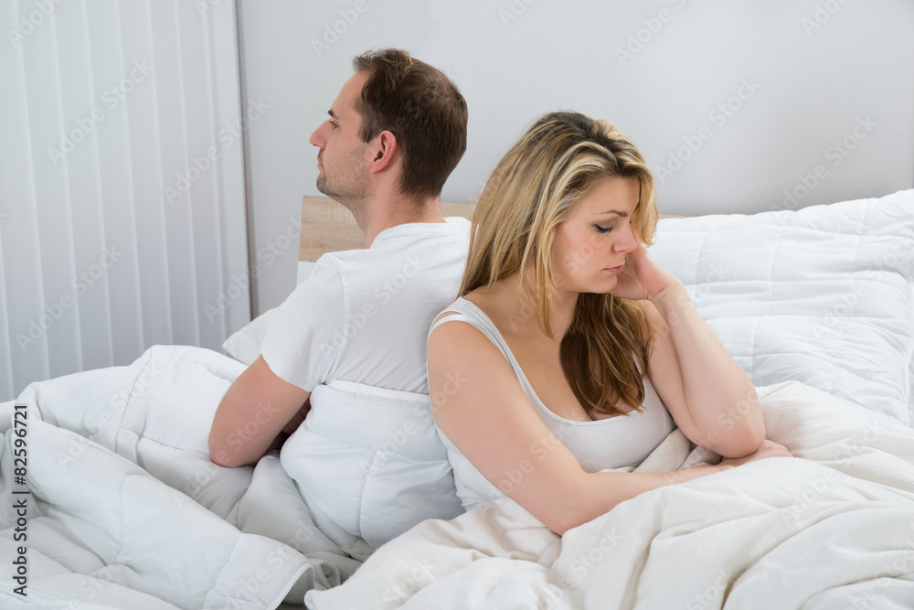 Unhappy Couple On Bed Unhappy Couple On Bed