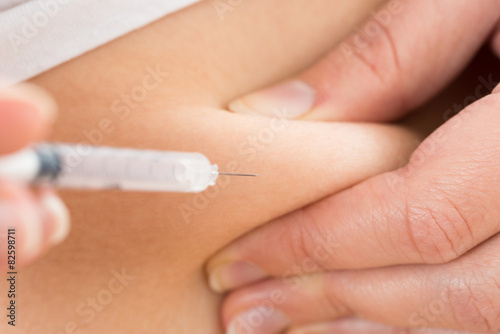 Patient Making Insulin Shot By Use Of Syringe