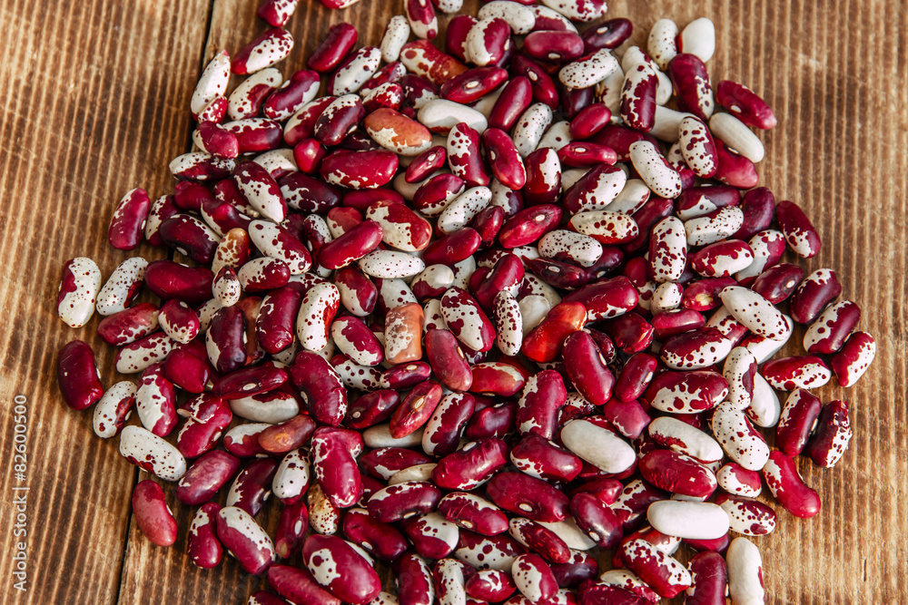 raw dried beans on a wooden surface raw dried beans on a wooden surface