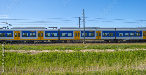 Train driving through nature in spring