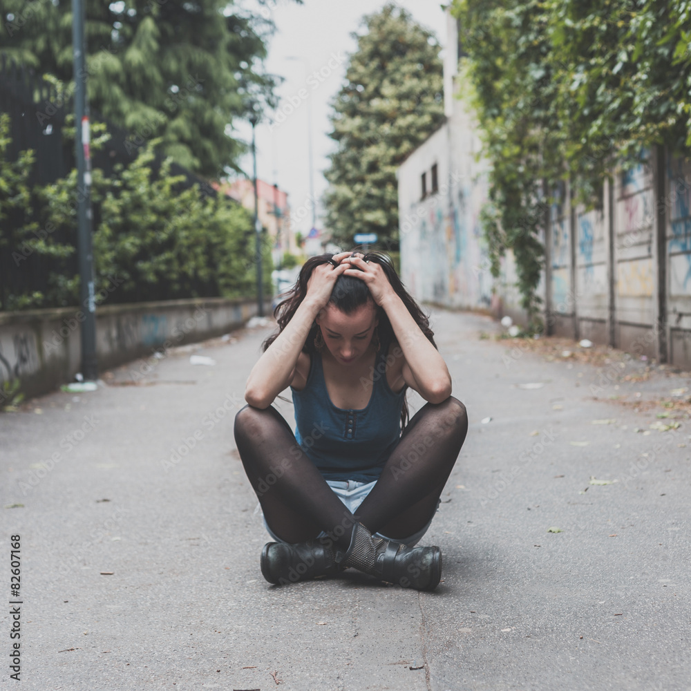 Fototapeta premium Beautiful girl posing in the city streets