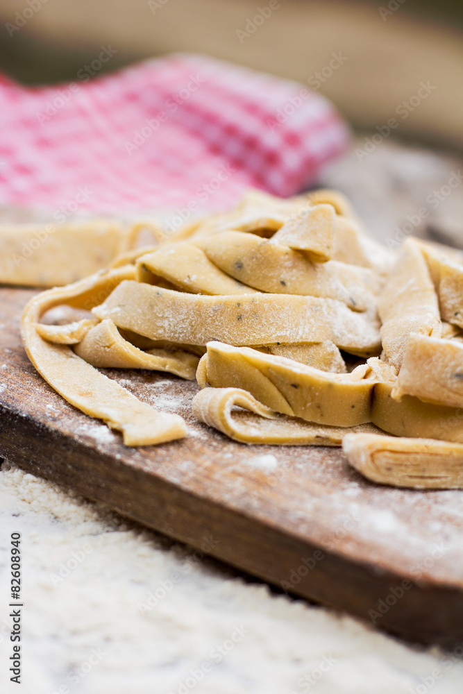 Homemade spaghetti, pasta or noodles on wooden table. Homemade spaghetti, pasta or noodles on wooden table.