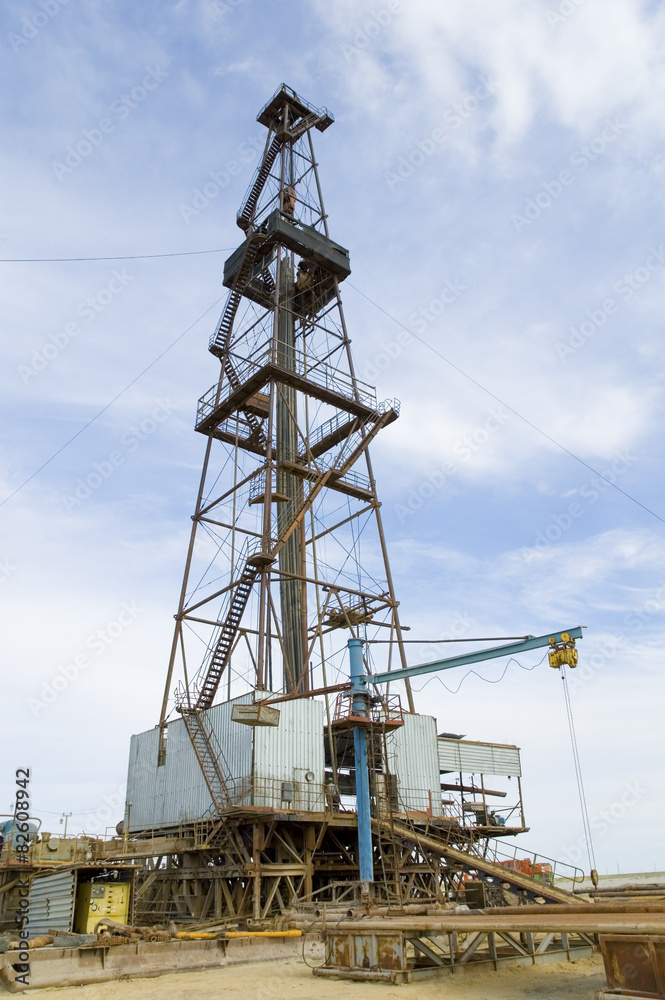 Loaded drilling rig under blue sky