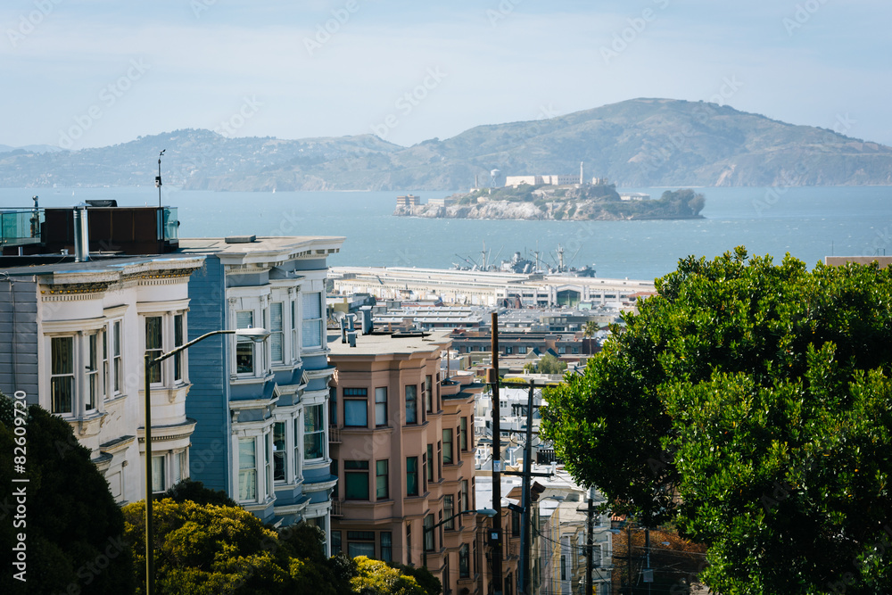 View of Alcatraz Island down a large hill on a street in San Fra
