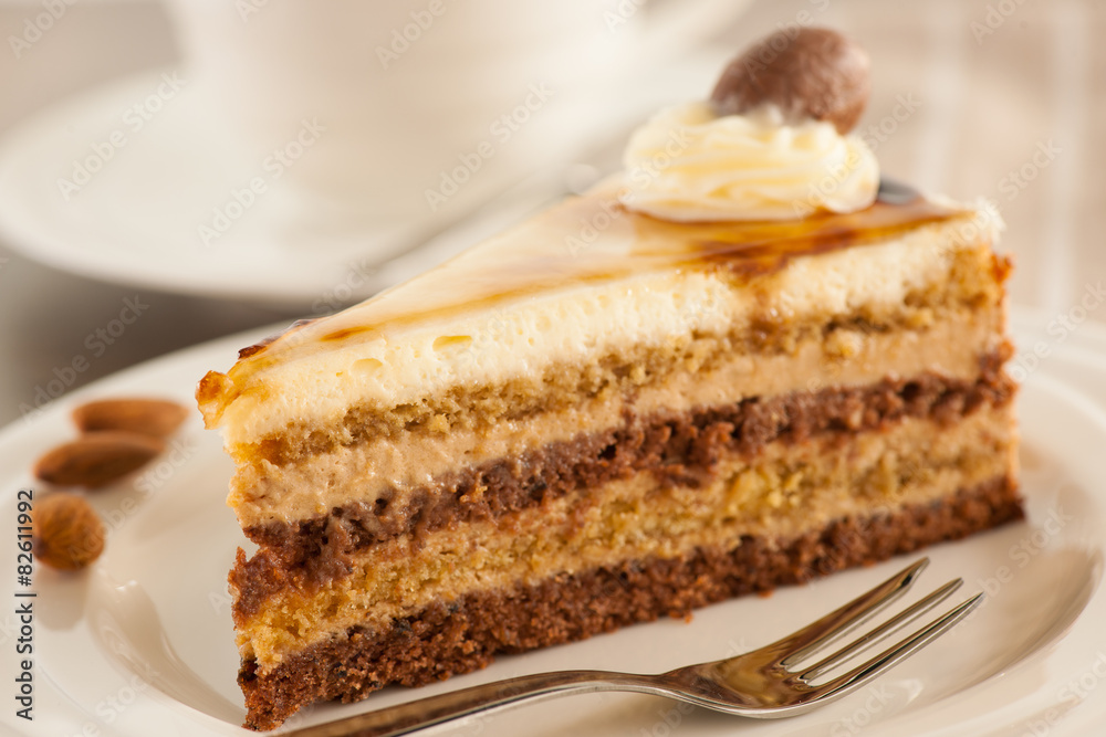 Deliceous slice og Caramel Mousse cake on a plate for breakfast Deliceous slice og Caramel Mousse cake on a plate for breakfast